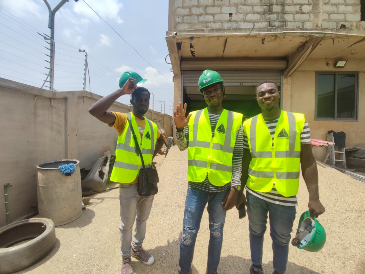Alucobond Ghana workers on a construction site installing aluminium composite panels in Ghana