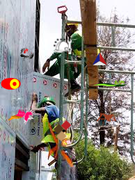 Alucobond Ghana team installing composite panel cladding on a commercial building in Tema Ghana