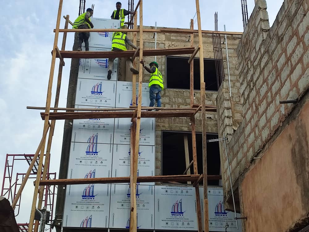 Alucobond Ghana installation crew working on a multi-storey building facade in Ghana